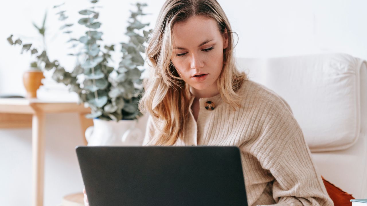 Freelancer working remotely on a laptop — outsourced video editing partner