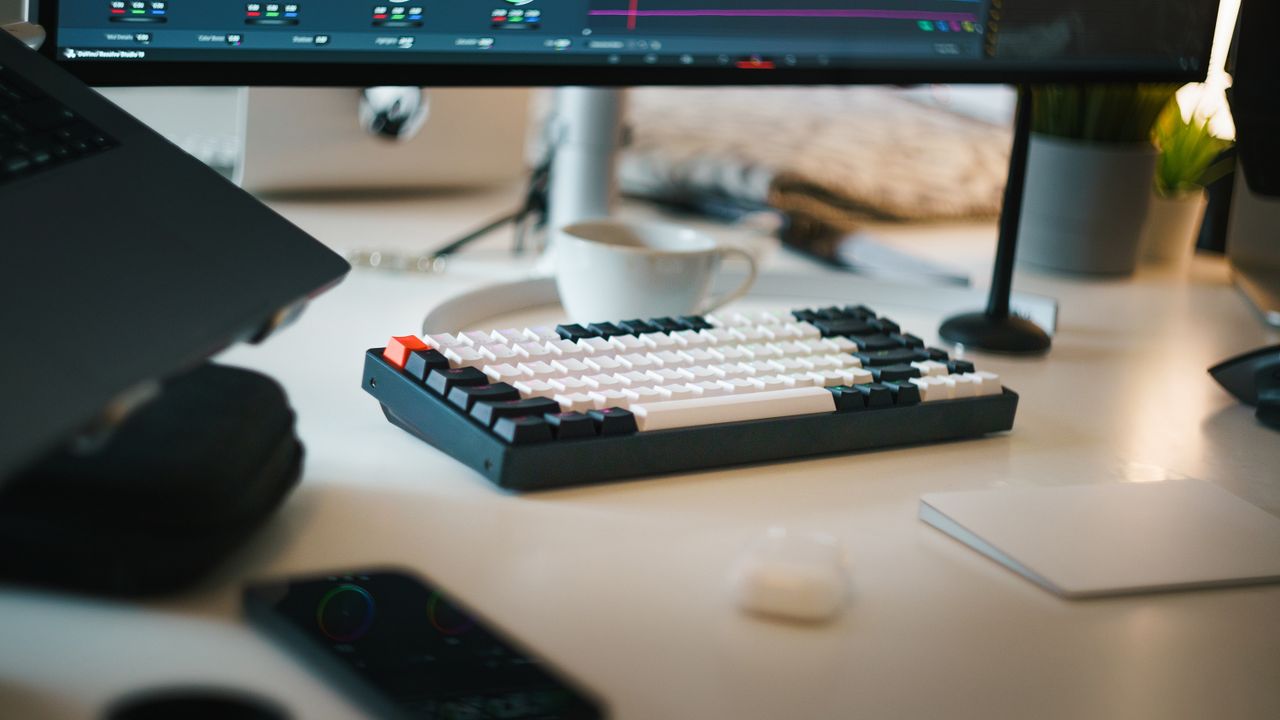 Editing workspace with grading panel and keyboard — an outsourced editor's setup